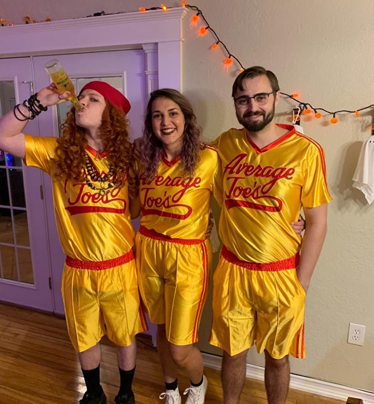 a reviewer photo of three people dressed in the matching jersey sets
