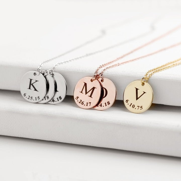three necklaces in three different finishes including rose gold, gold, and silver