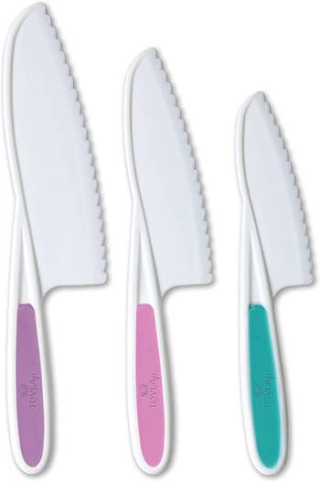 Three knives in different sizes in purple, pink, and teal colors