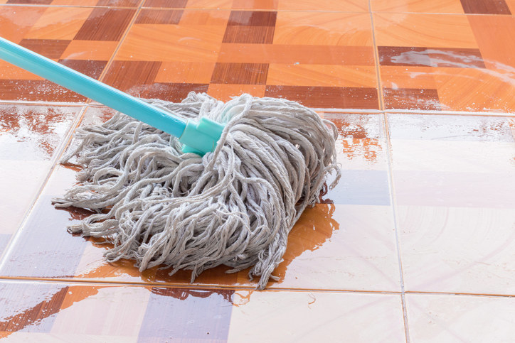 Mop on wet tile floor
