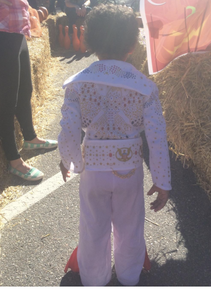 Reviewers photo of their kid dressed up in Elvis costume