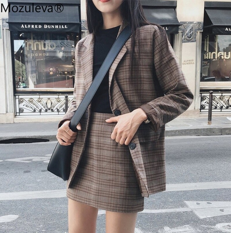 the plaid set paired with a black top and crossbody bag