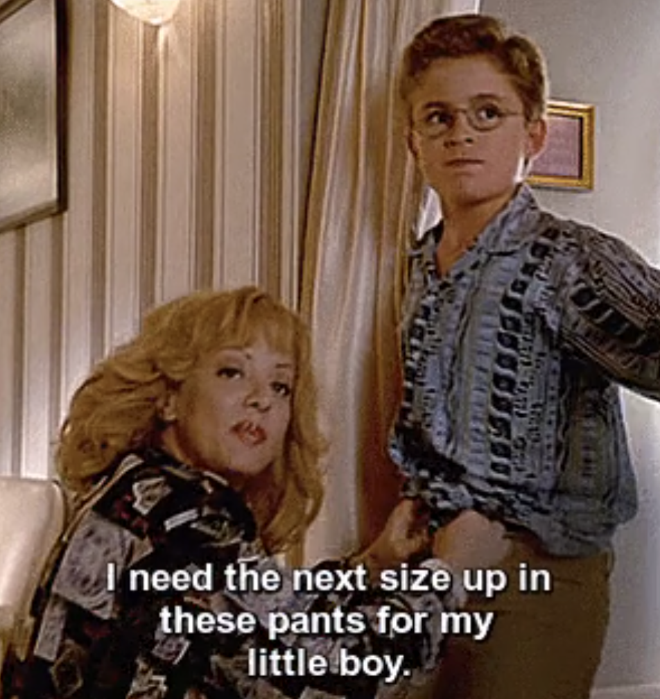 Beverly Goldberg from &quot;The Goldbergs&quot; helping her son try on pants in a dressing room: &quot;I need the next size up in these pants for my little boy&quot;