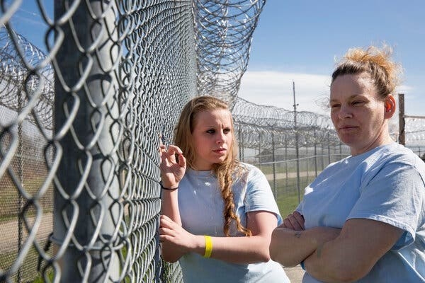 Jacinta and Rosemary talking at the prison fence