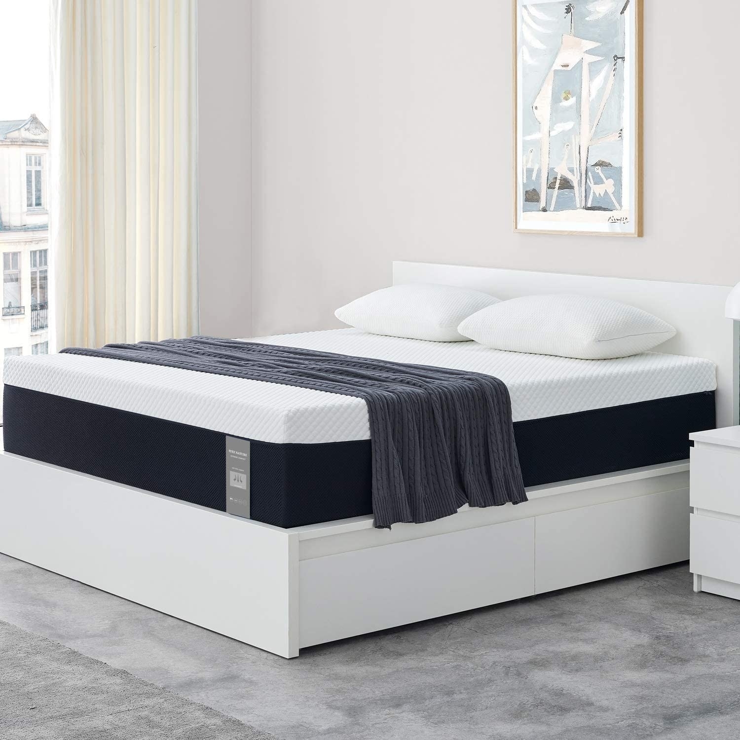 A mattress on top of a bed frame