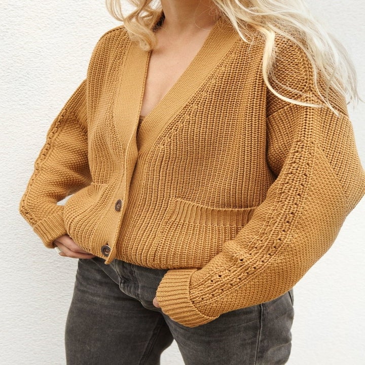 Model wearing the caramel sweater