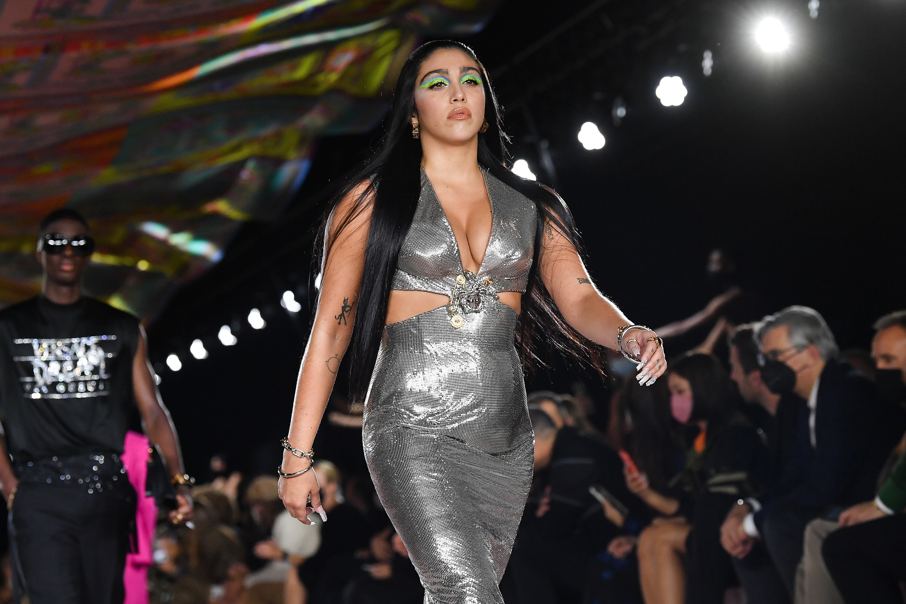 Lourdes walks the runway in a fashion show