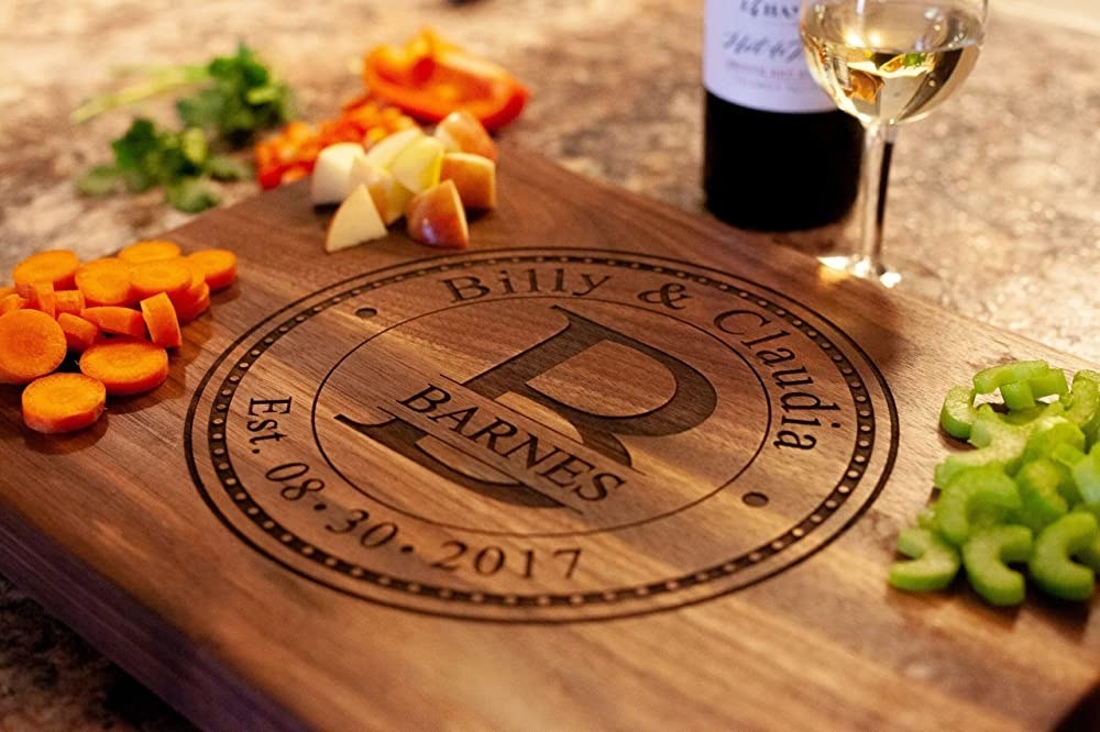 Product image of wooden cutting board engraved with &quot;Billy &amp;amp; Claudia Barnes, Est. 08.30.2017&quot;