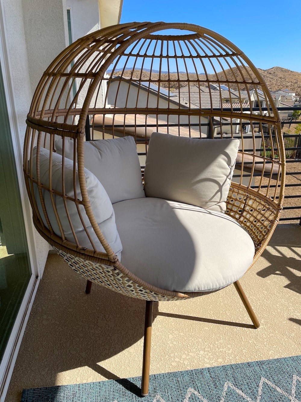 the circular woven chair with four cushions