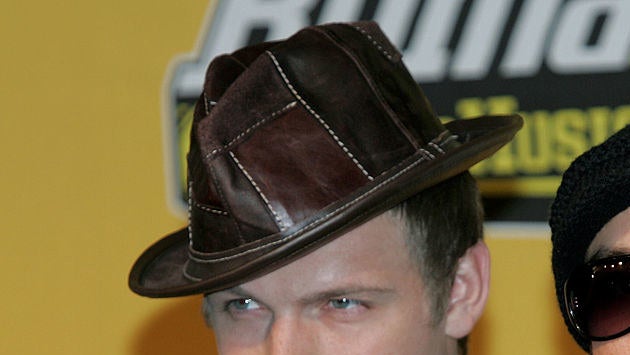 nick carter with his fedora falling off