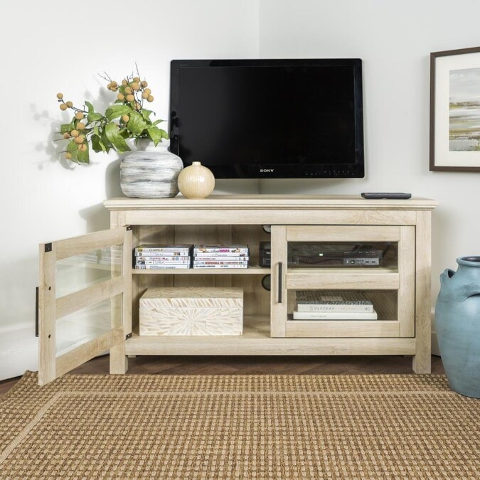Corner TV stand in color &quot;White Oak&quot; shown in a living room