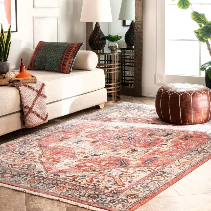 Area rug in color &quot;Orange&quot; shown in a living room