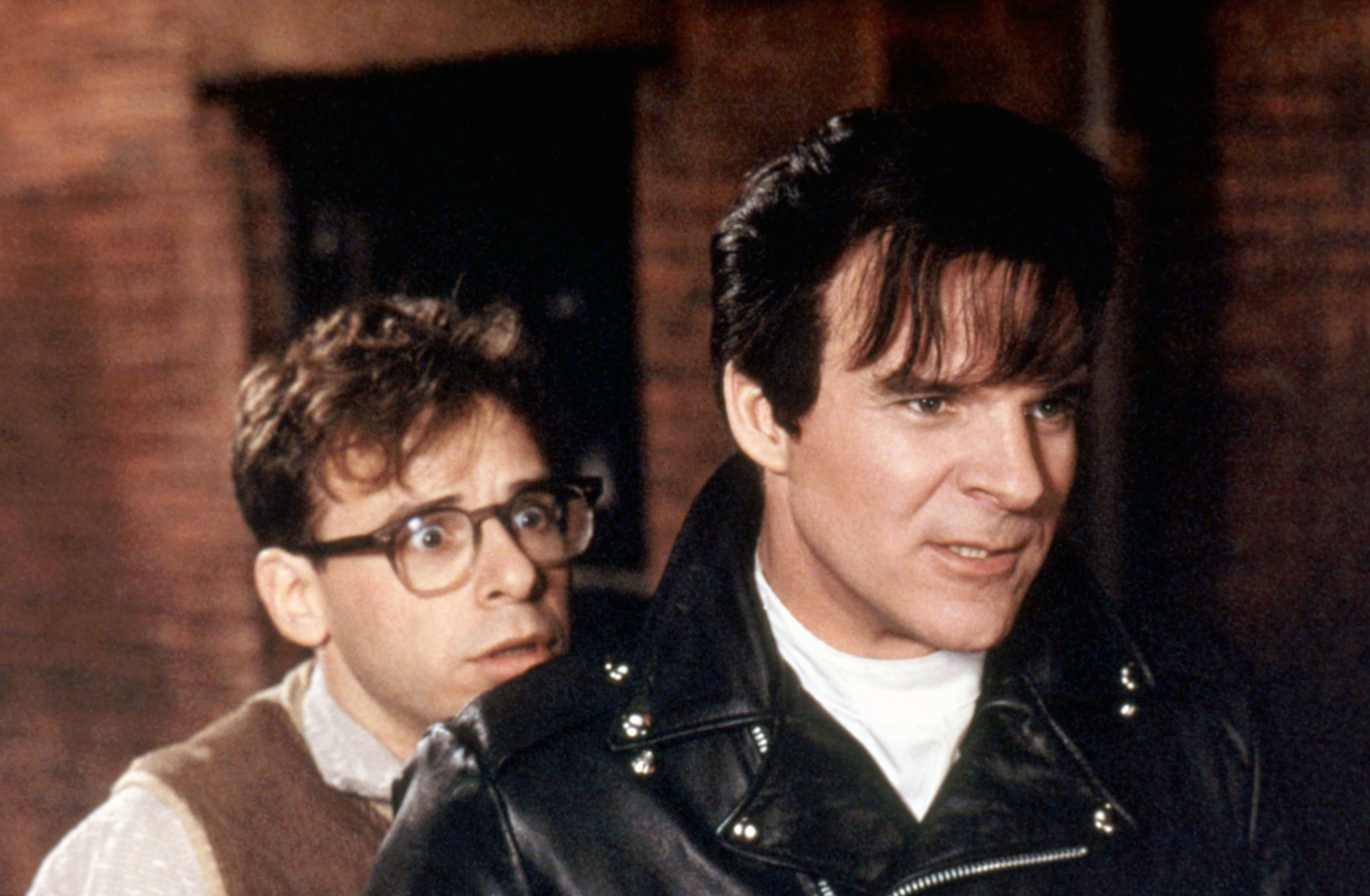 Rick Moranis cowering behind an angry Steve Martin