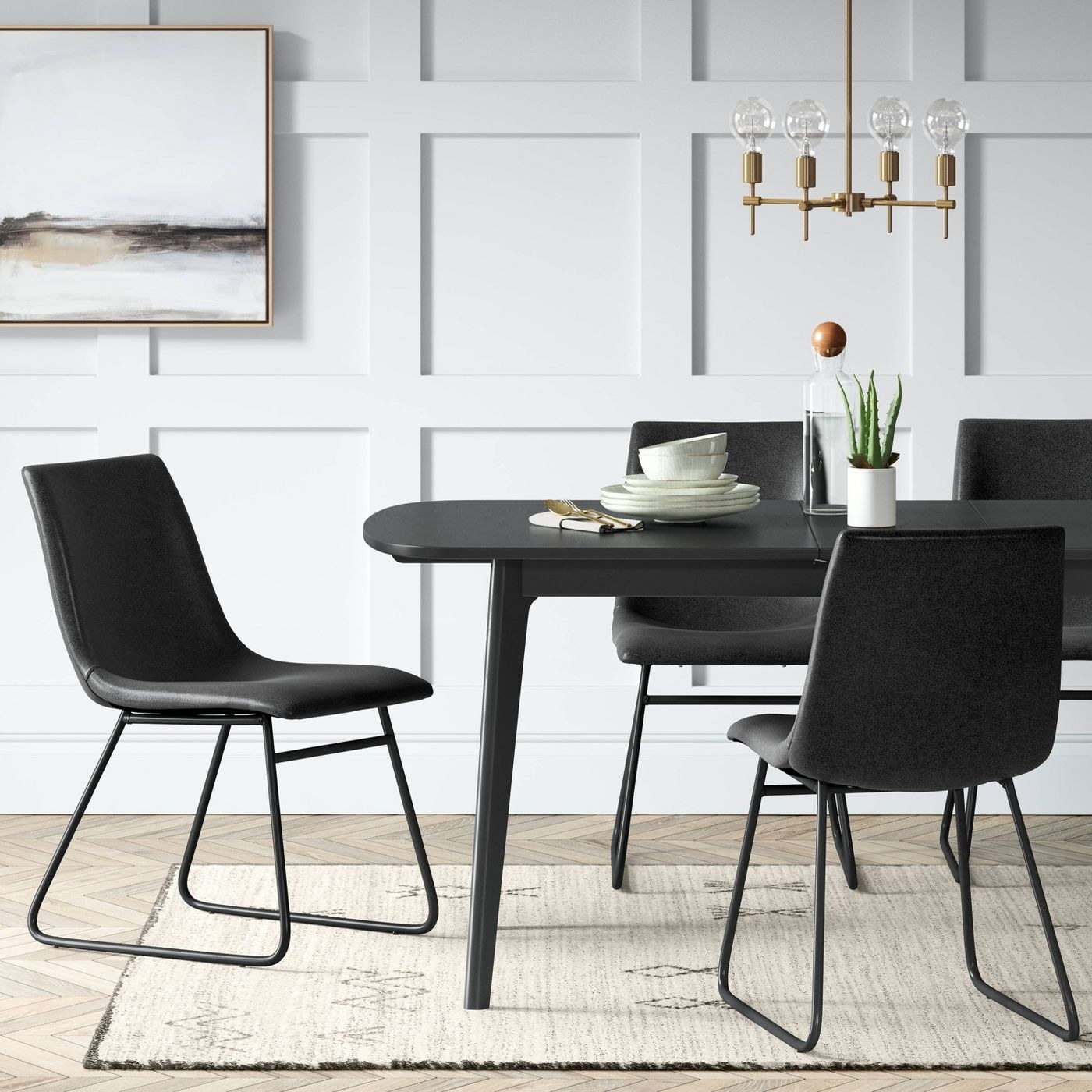 Black faux leather chairs as a black table