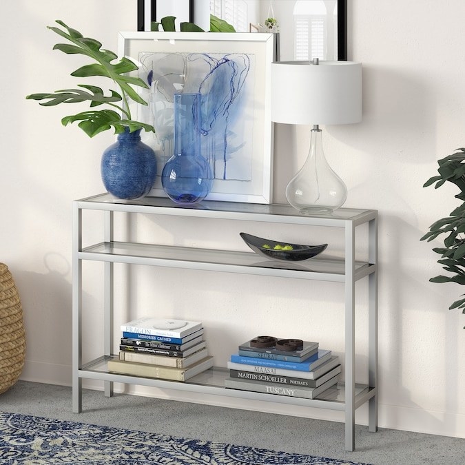 Console in color &quot;Nickel&quot; styled with home decor items