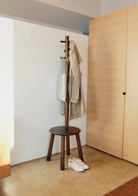 Brown coat rack in an entryway