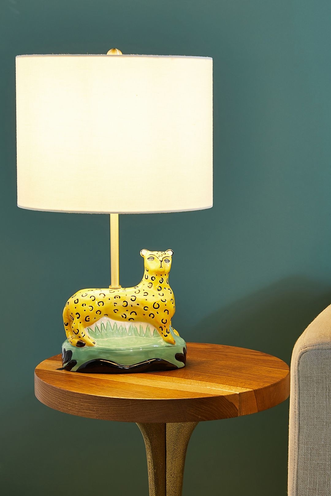 the cheetah table lamp with a simple white shade