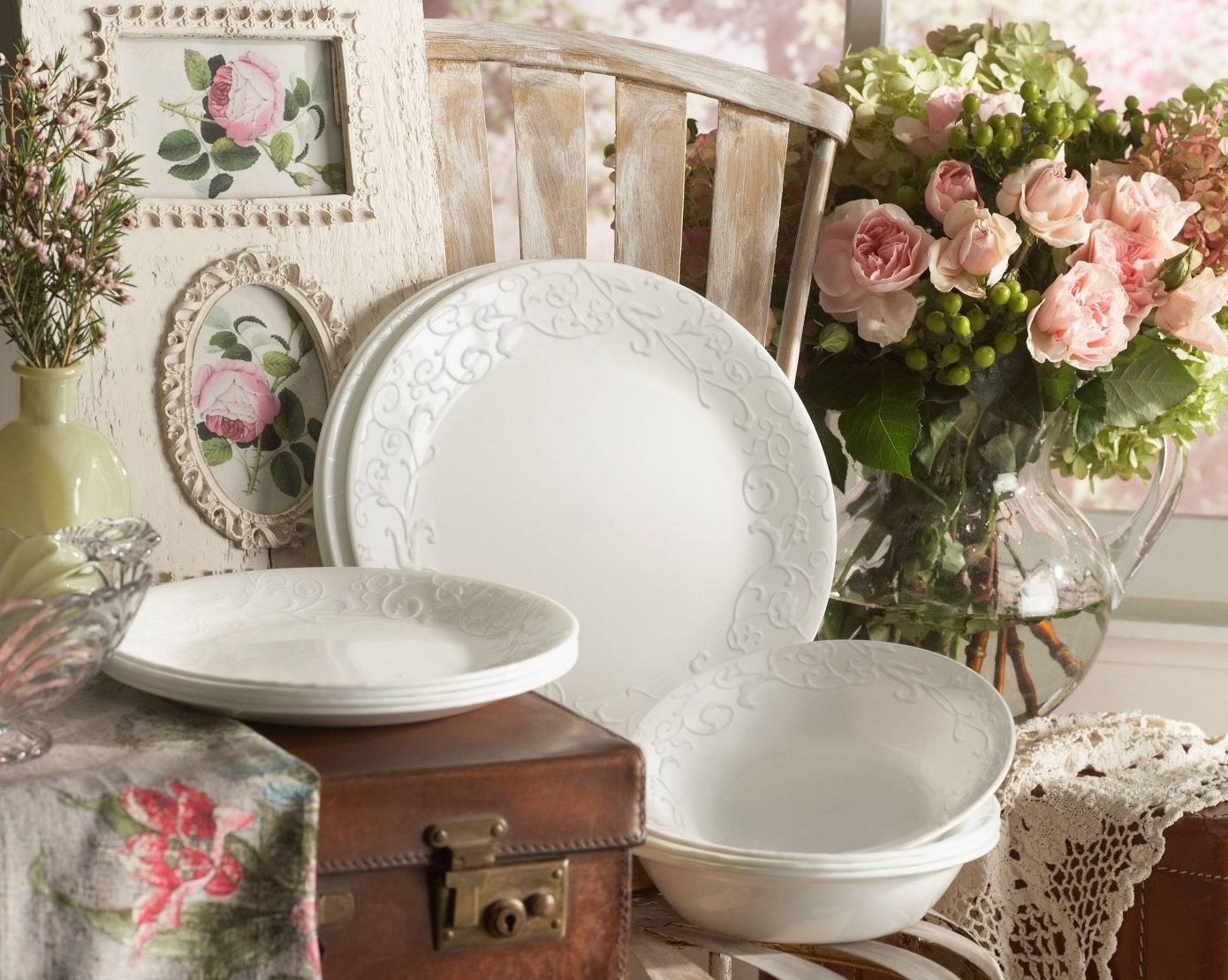 White embossed plates with pink and green antiques
