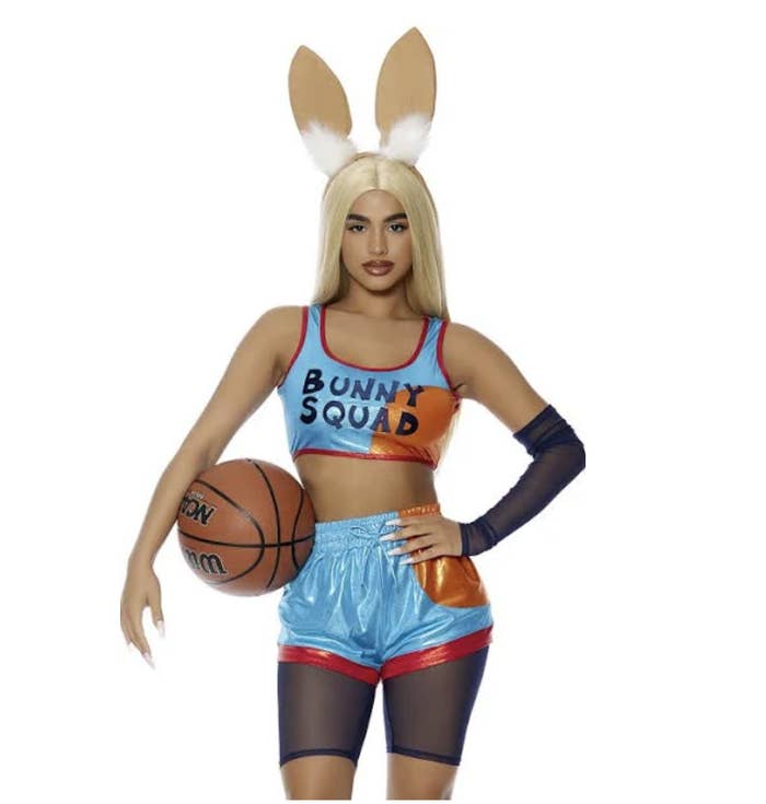 A woman wearing a crop tank top and shorts that resemble the uniforms from the new Space Jam movie