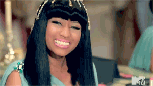Nicki Minaj sarcastically grinning