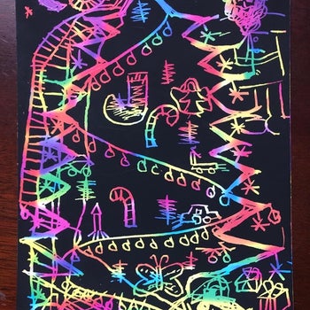 Reviewer's photo of their child's rainbow art