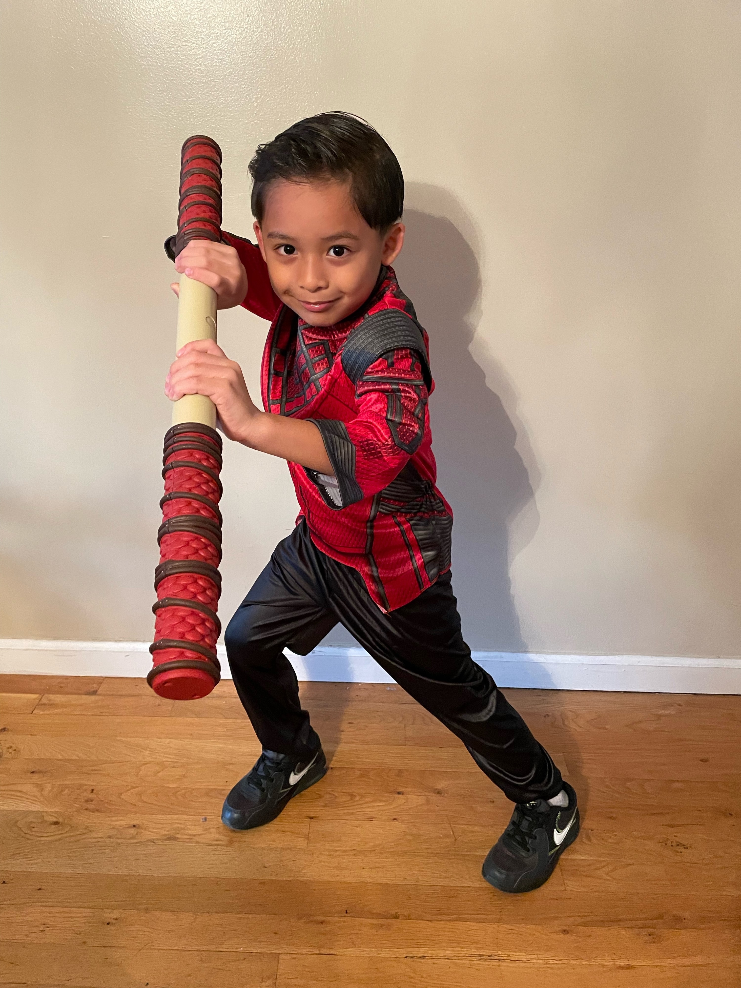a child in a shang chi costume