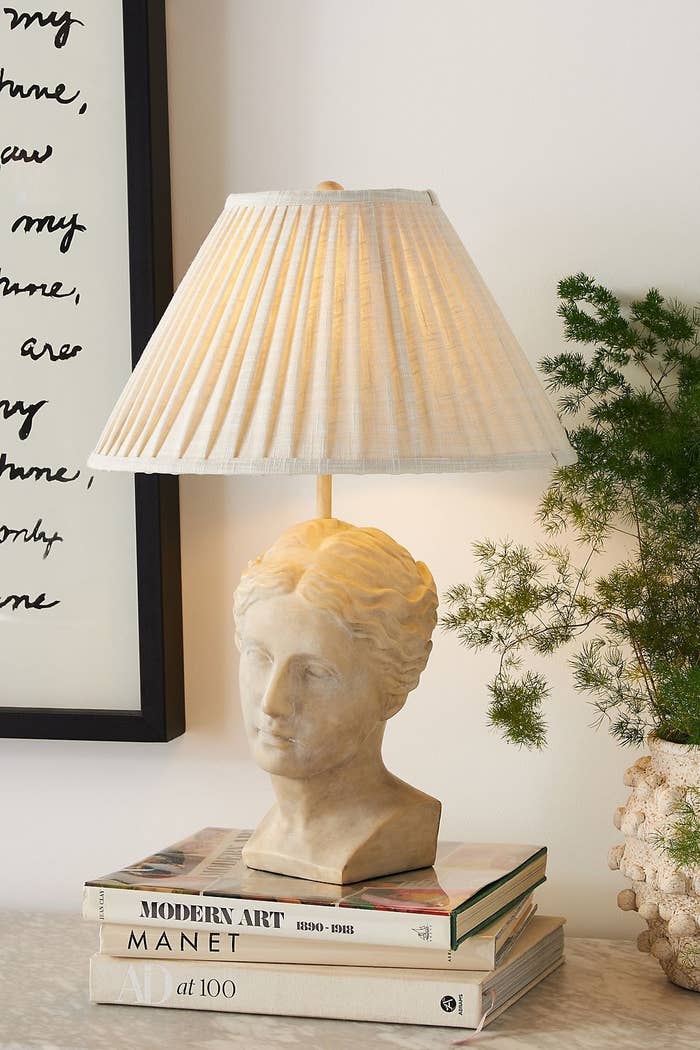 the grecian table lamp with a white pleated shade