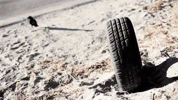 GIF of a rubber tire on a beach