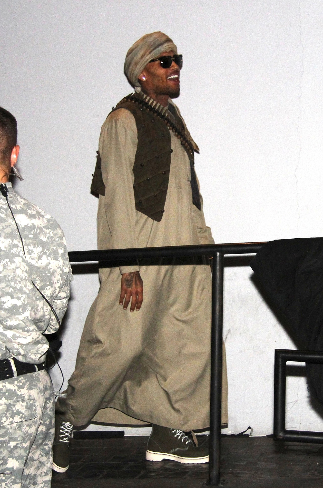 Chris Brown wearing a robe and turban