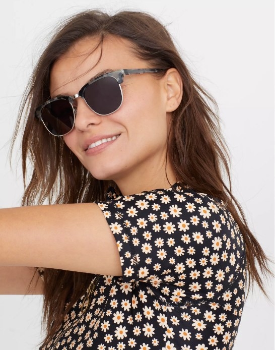 Model wearing gray sunglasses