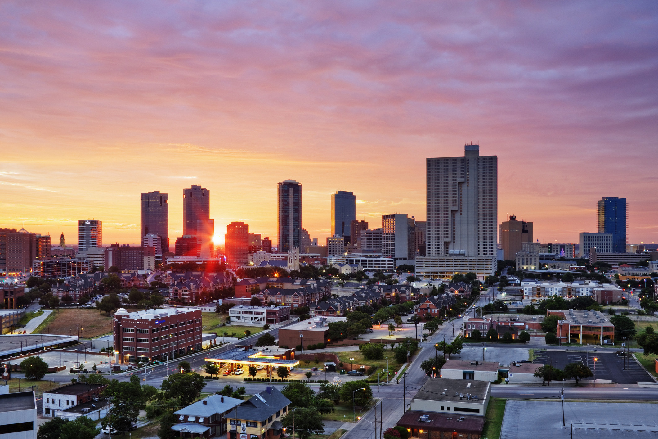 Sun rising through buildings in the Fort Worth skyline