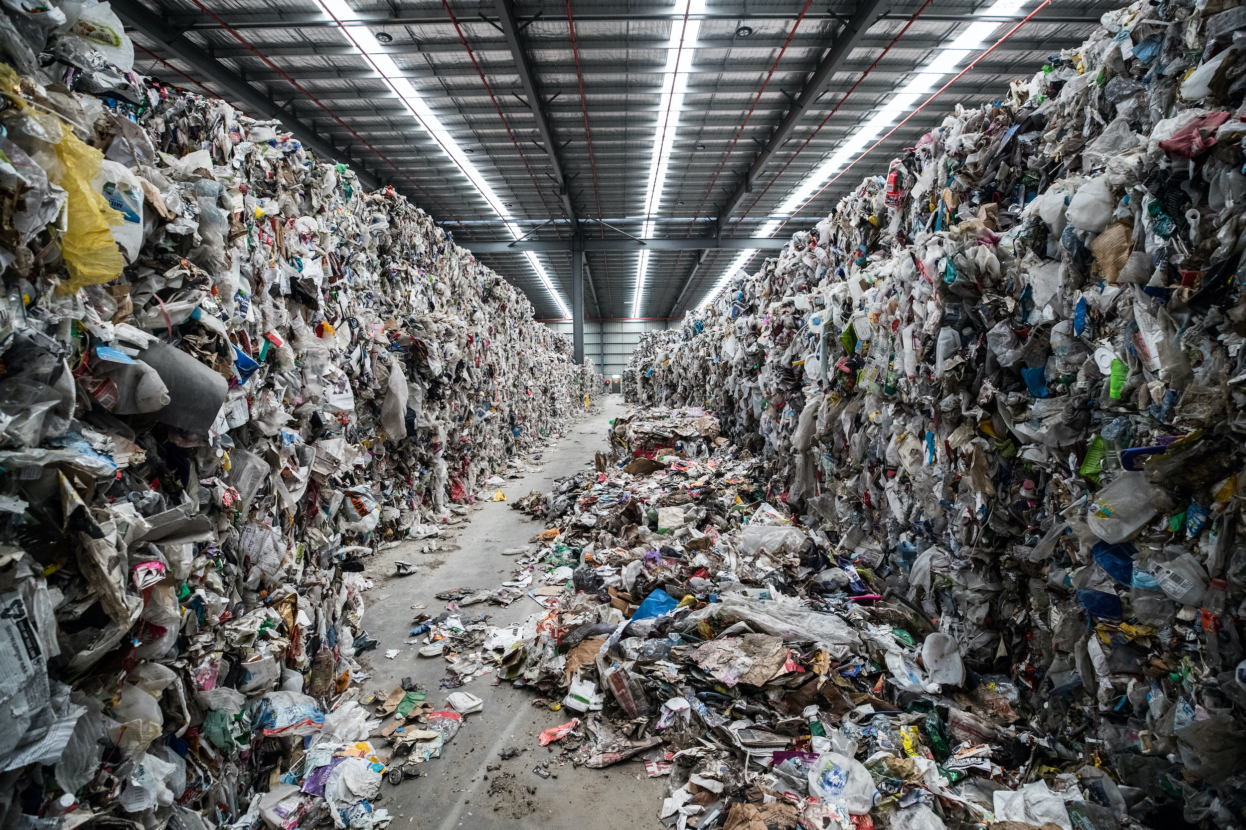 Trash and recycling is seen inside a warehouse in Australia