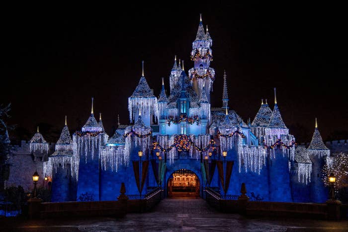 Sleeping Beauty&#x27;s castle covered in icicles and lights