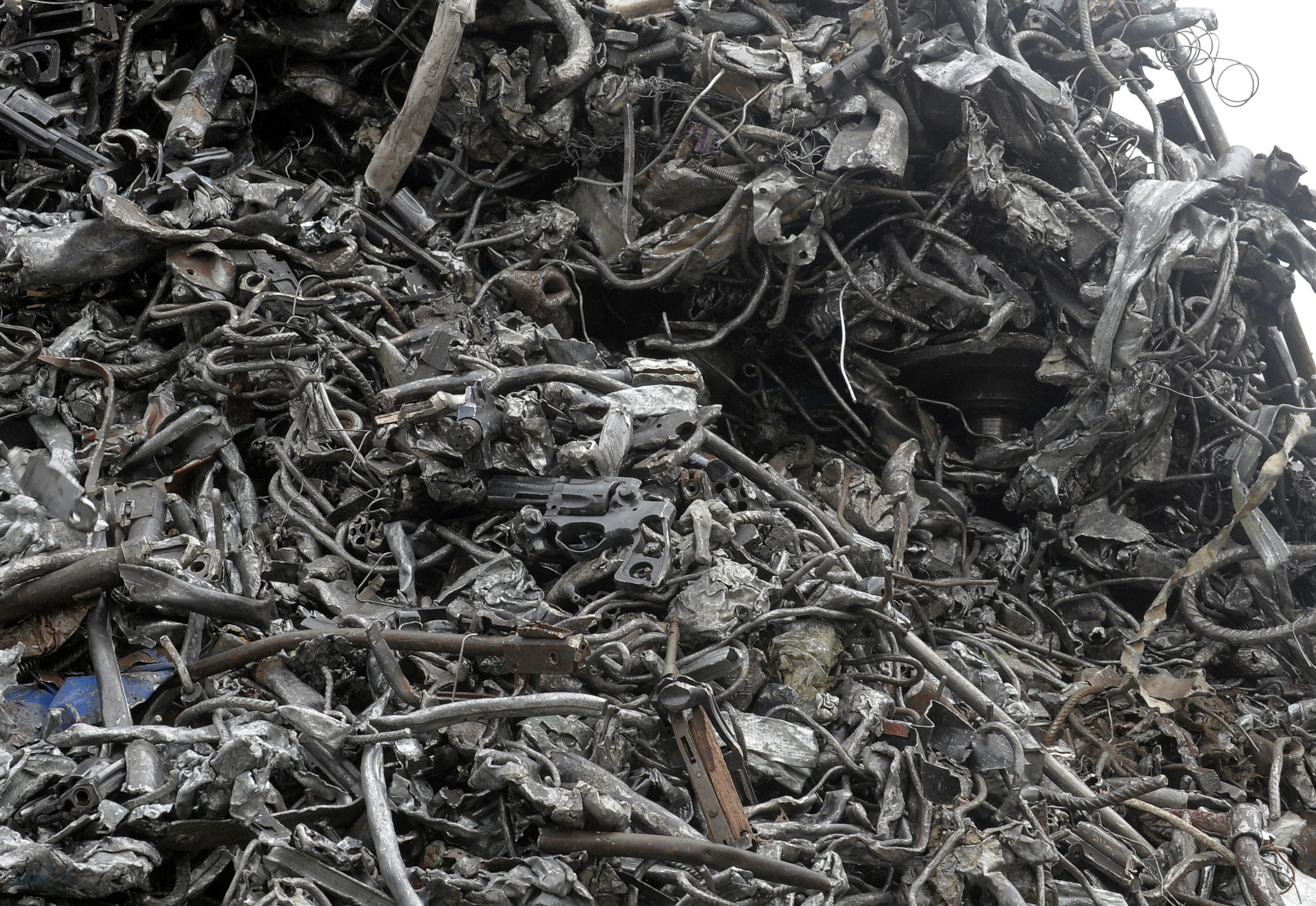 Metal scraps taken from weapons pile up in a landfill in France