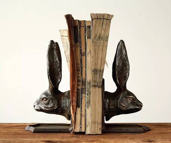 Two black rabbit head shaped bookends