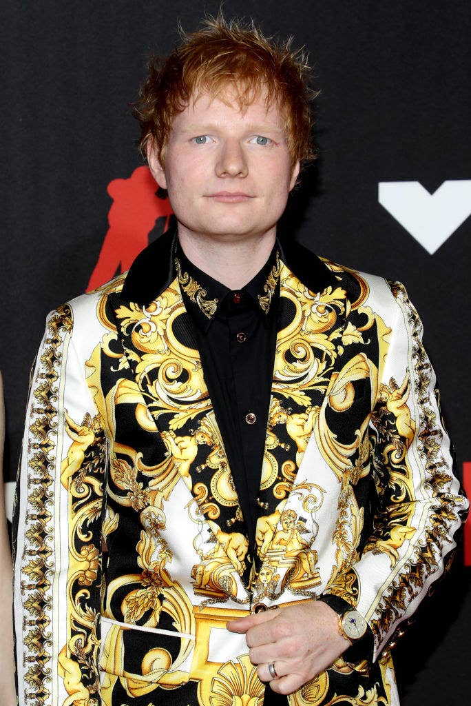 Ed Sheeran wears a multicolored printed blazer at a red carpet event