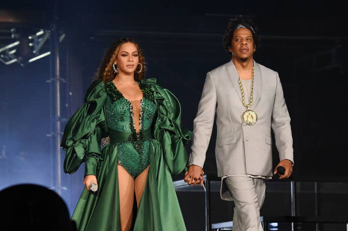 Beyoncé and Jay-Z hand-in-hand on stage during their concert