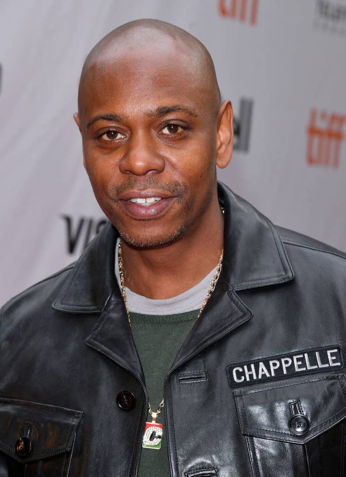 David wearing a leather jacket that says Chappelle over a front pocket
