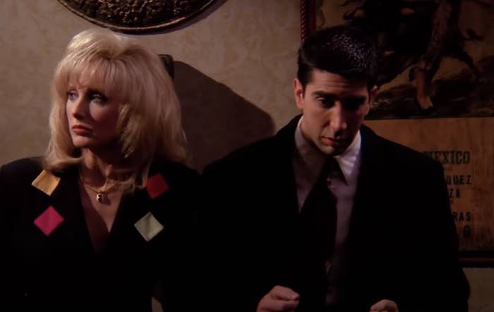 Ross is next to a female companion, looking shameful