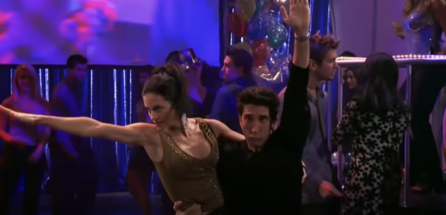 Monica and Ross are dancing on the dance floor