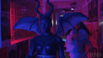 Michaela Coel as Arabella Essiedu in &quot;I May Destroy&quot; walks down a dark hallway wearing a devil costume.
