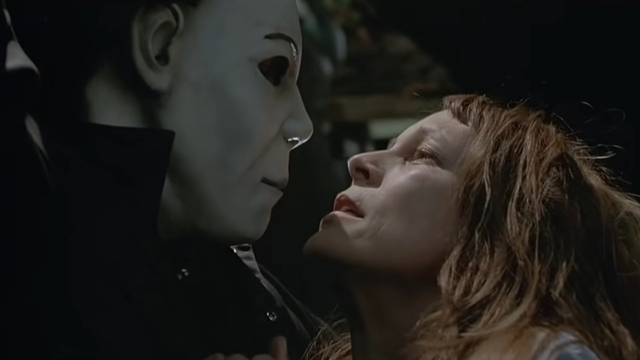 A white masked Michael Myers and Laurie Strode are face to face