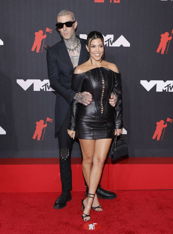 The couple posing together for photographers at the MTV VMAs