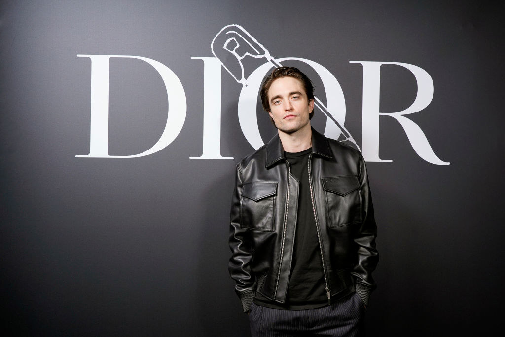Robert in a leather-like jacket at a Dior event