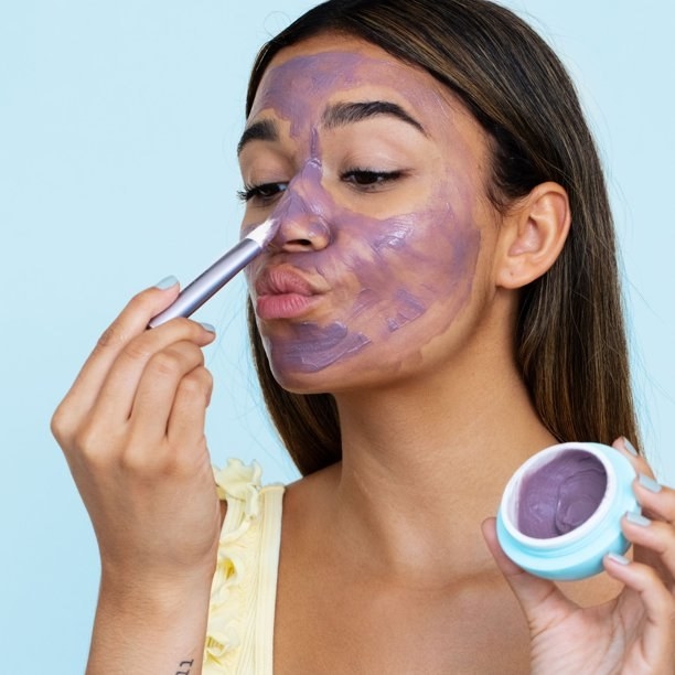 Model using the Bubble Skincare Come Clean Detoxifying Clay Mask