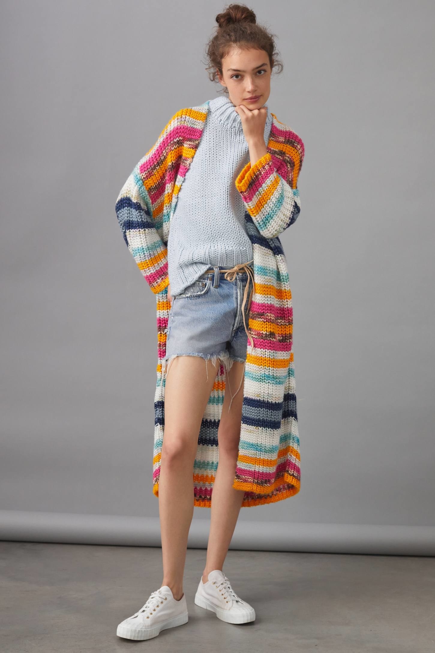Model wearing the orange striped knit long cardigan