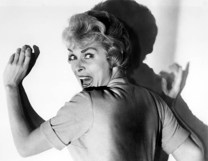 Janet Leigh looks behind her back while screaming in a promotional image for Psycho