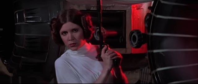 Princess Leia wielding a blaster in &quot;Star Wars: Episode IV - A New Hope&quot;