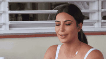 Kim Kardashian laughing.