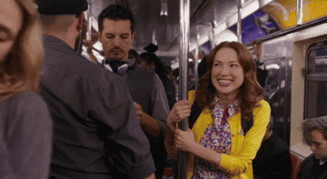 Kimmy Schmidt riding the NYC subway.